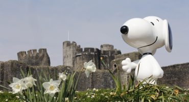 An image of Snoopy stood in front of Caerphilly Castle